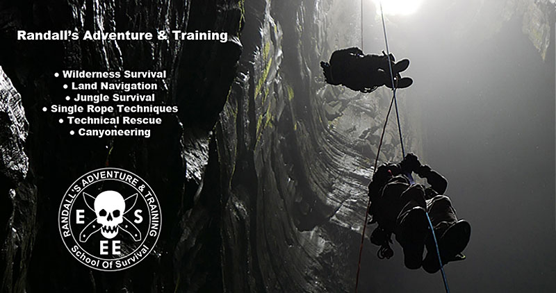 Randall's Adventure & Training - two men on ropes going down into a deep hole