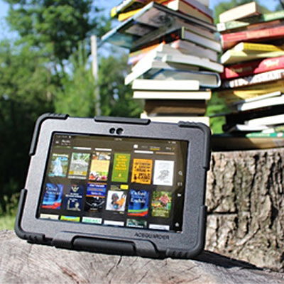 A survival kindle next to a pile of books on a log