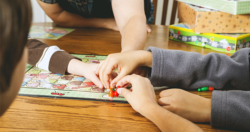 Kids playing a board game