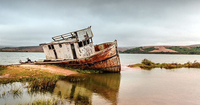 Abandoned boat stuck on the shore