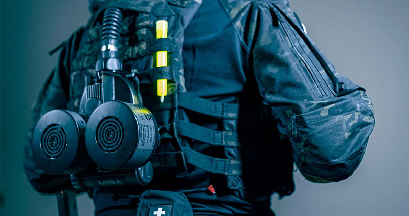 Mira Safety MB-90 Powered Air Purifying Respirator (PAPR) on the back of a tactical vest