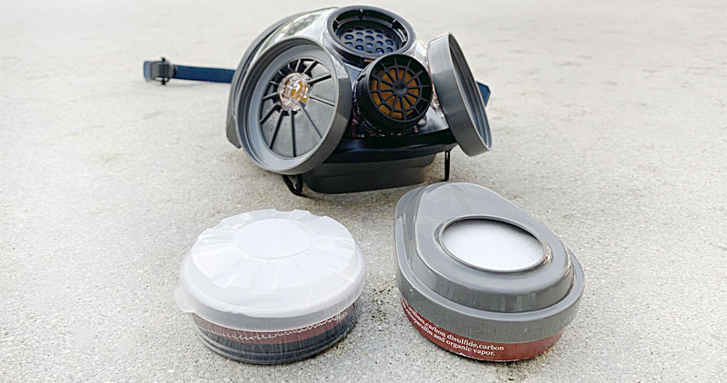 Parcil Safety P-A-1 filter on the ground next to a mask