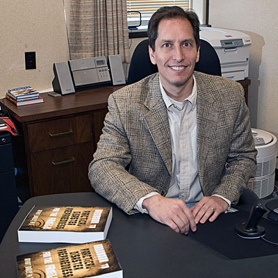 Dr. Arthur Bradley sitting at a desk