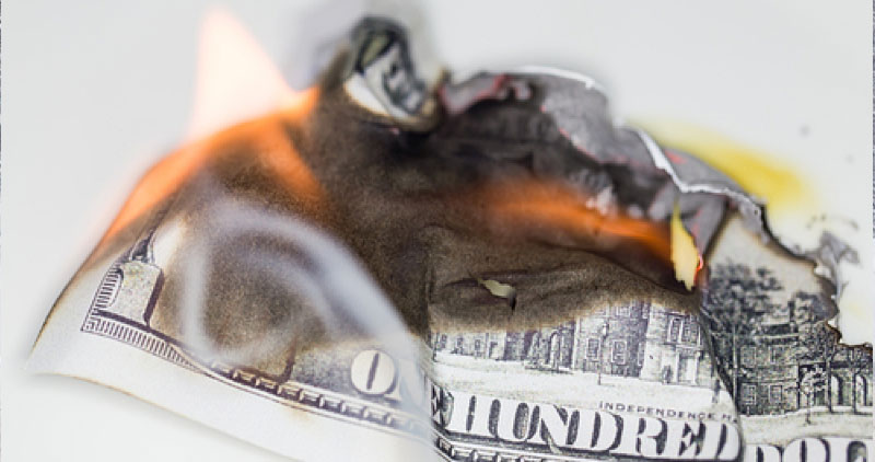Hundred dollar bill on fire