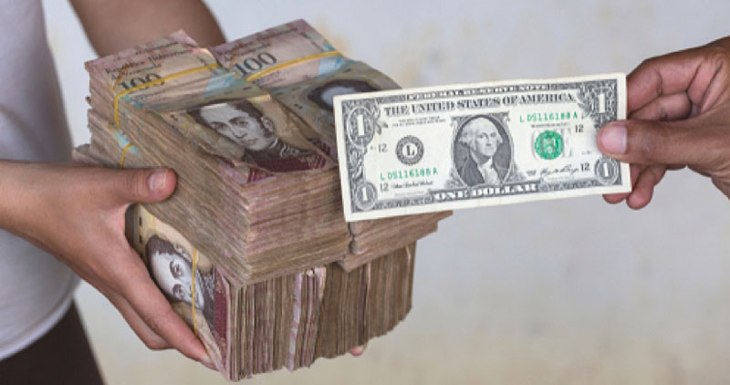 A pile of money next to a US dollar