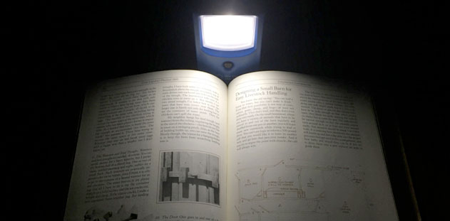 THRIVE Solar Lantern illuminating a book