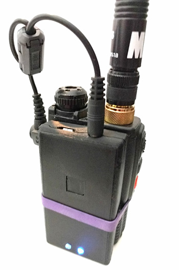 Mobilinkd TNC 2 terminal node controller attached to a radio with a rubber band