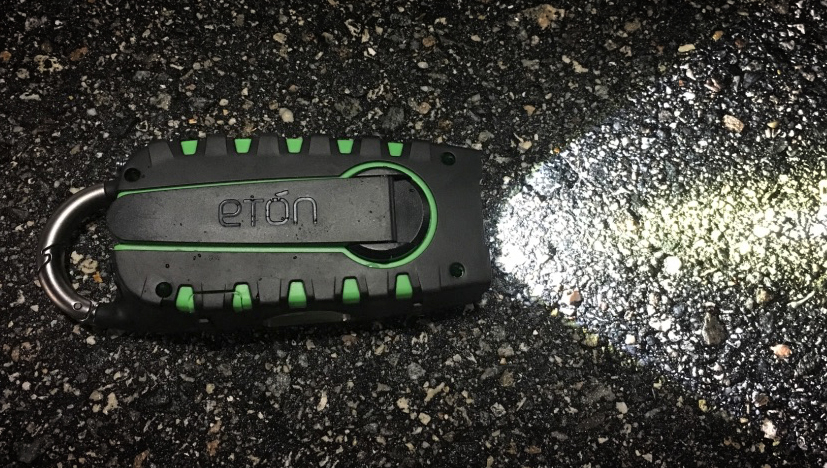 Eton Scorpion II on pavement showing flashlight