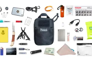 Everyday Carry EDC Bag with contents like a signal mirror, notebook, pocket knife