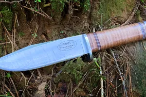 Fallkniven Northern Light Frej Model NL4 laying on a woodland floor