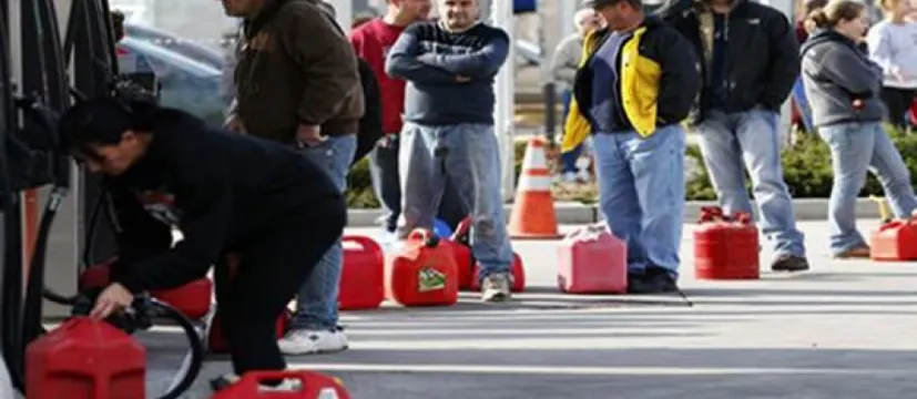 People in line to get gas with empty cans