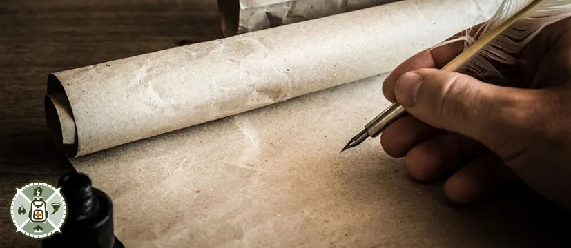 Parchment and a fountain pen in a mans hand