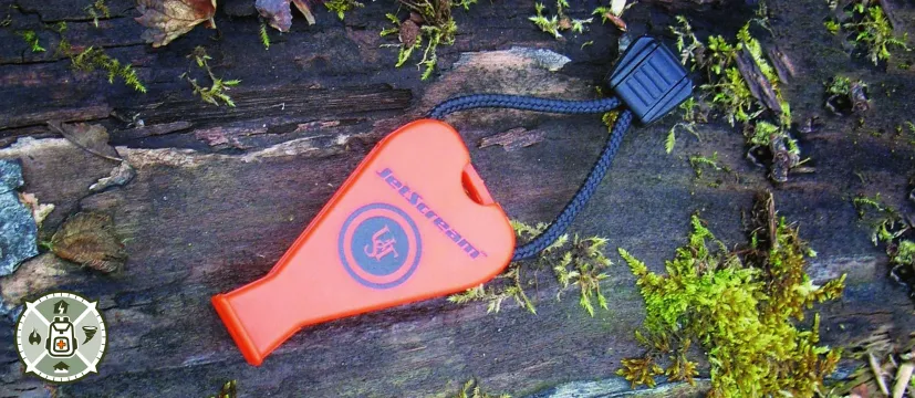 UST JetScream Whistle sitting on wood