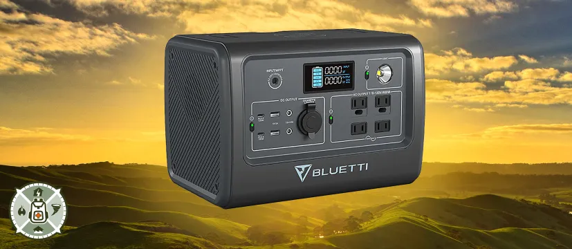 The Bluetti EB70S Portable Power Station superimposed over hills and sky during sunset